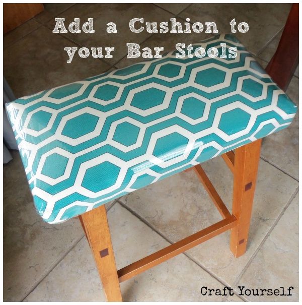 bar stool makeover - staple fabric on to cushion.